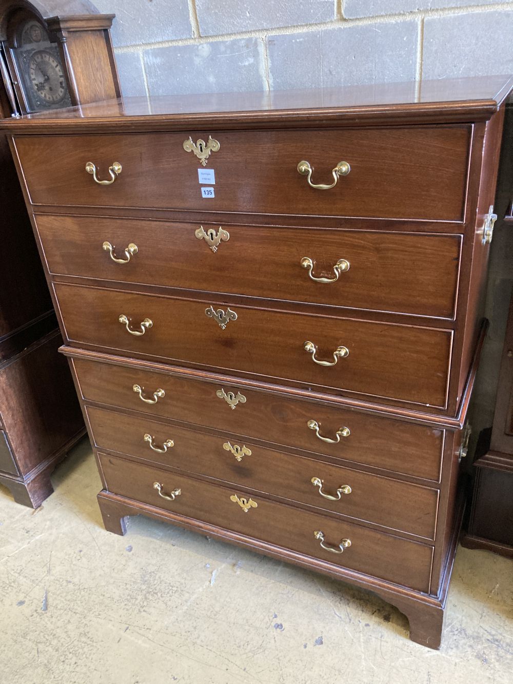 A George III mahogany chest of six drawers, in two sections, width 120cm, depth 54cm, height 145cm